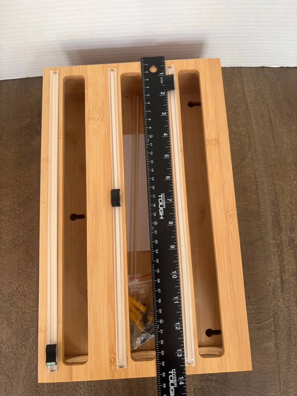 3-in-1 bamboo plastic wrap, aluminum foil, and parchment paper dispenser.
